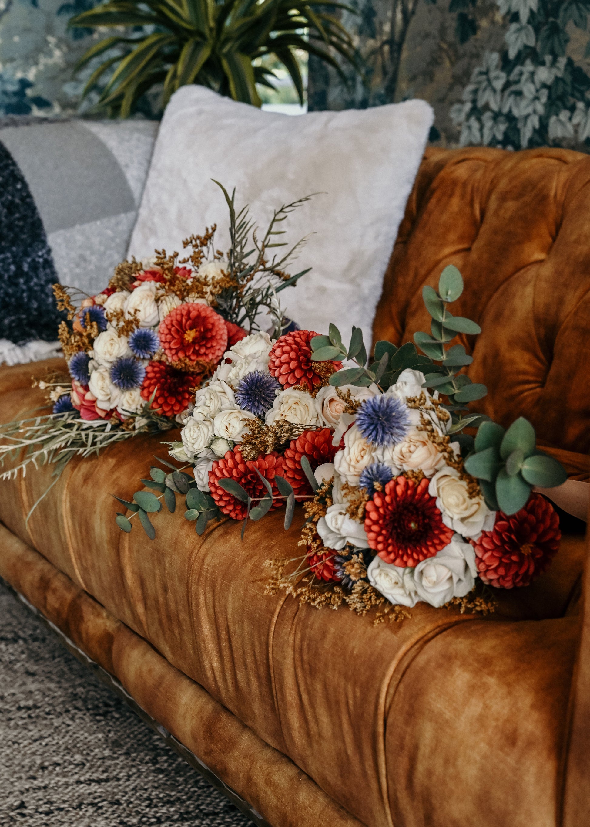 Rustic statement bridal flowers for the bride and bridesmaids. Copper dahlia and blue echinops to make them pop. Texture and colour on point - The Wildstyler bridal flowers Kapiti, NZ